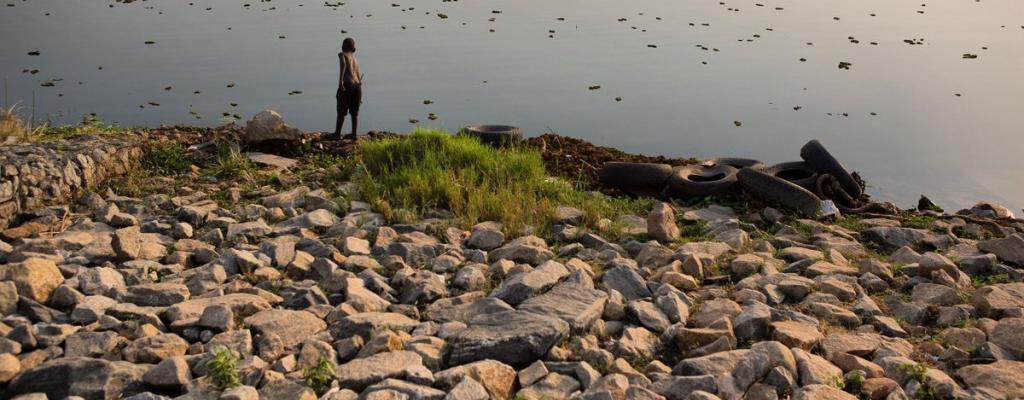 A boy is seen fishing by the shores of River Nile in Moyo district